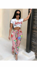 Load image into Gallery viewer, GRAPHIC PRINT SHORT SLEEVE TOP WITH FLORAL PRINT STRIPED PANTS
