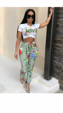 Load image into Gallery viewer, GRAPHIC PRINT SHORT SLEEVE TOP WITH FLORAL PRINT STRIPED PANTS
