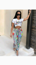 Load image into Gallery viewer, GRAPHIC PRINT SHORT SLEEVE TOP WITH FLORAL PRINT STRIPED PANTS
